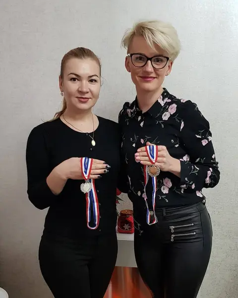 Magdalena Czajor and Oxana from the ProLash team holding their Irish Lash Championship medals